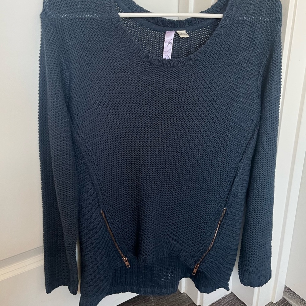 Navy blue sweater with gold zippers